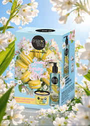 Organic shop Sweet Spring Mood gift set with body care products surrounded by cherry blossoms.
